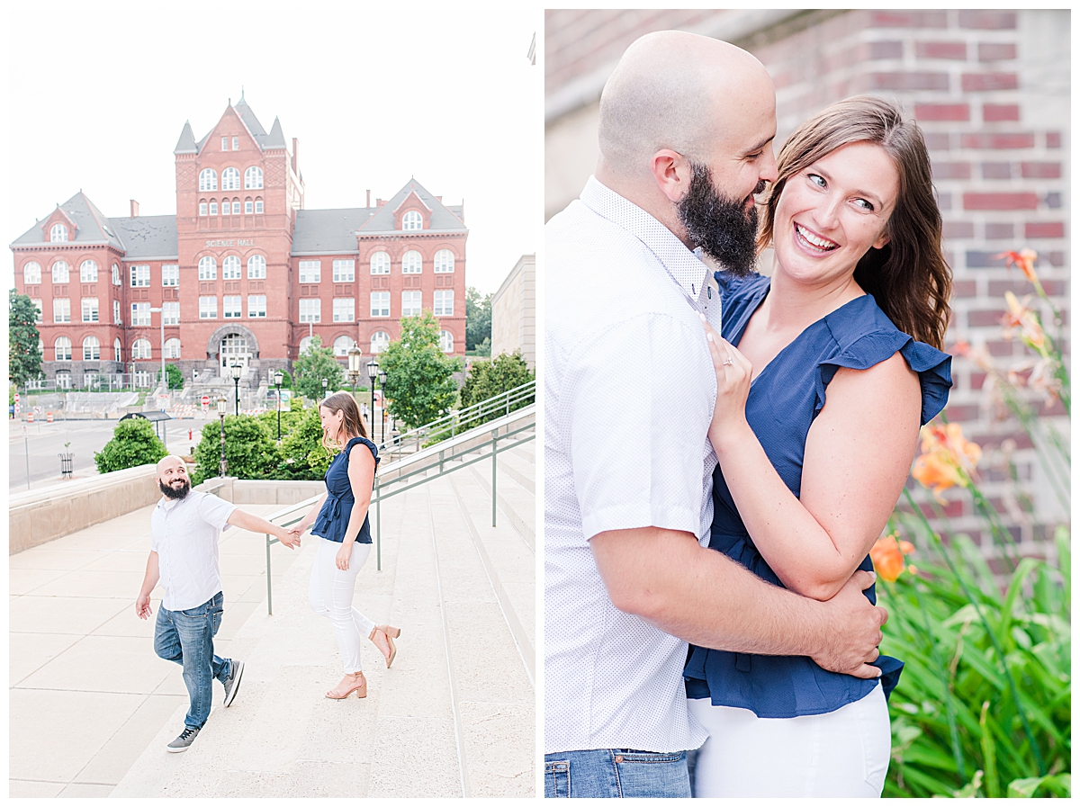 A couple smiling, posing for engagement photos in downtown Madison, WI