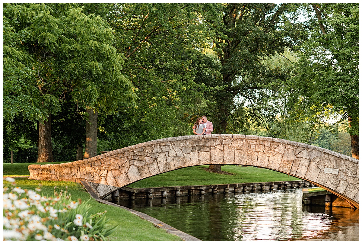 couple on the bridge at doty park in neenah by wedding photographer, morgan madeleine photography