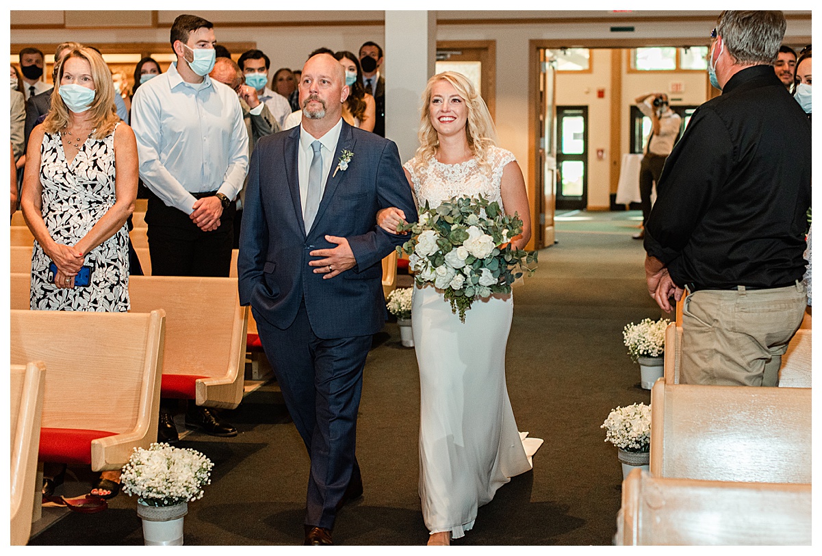bride and father walking down the aisle at a high point church wedding in madison