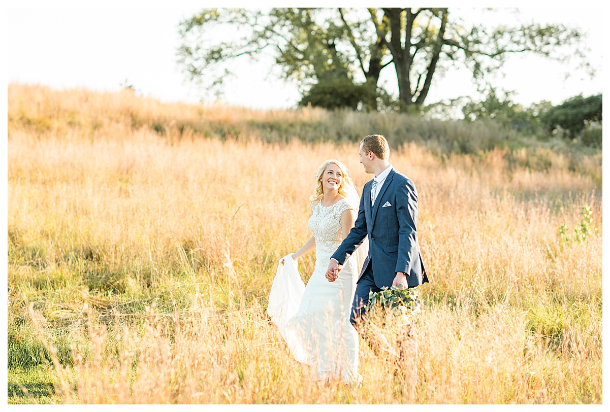 bride and groom walking at pope farm by morgan madeleine photography, wisconsin wedding photographer