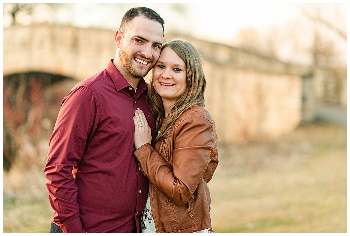couple smiling for tenney park engagement photos