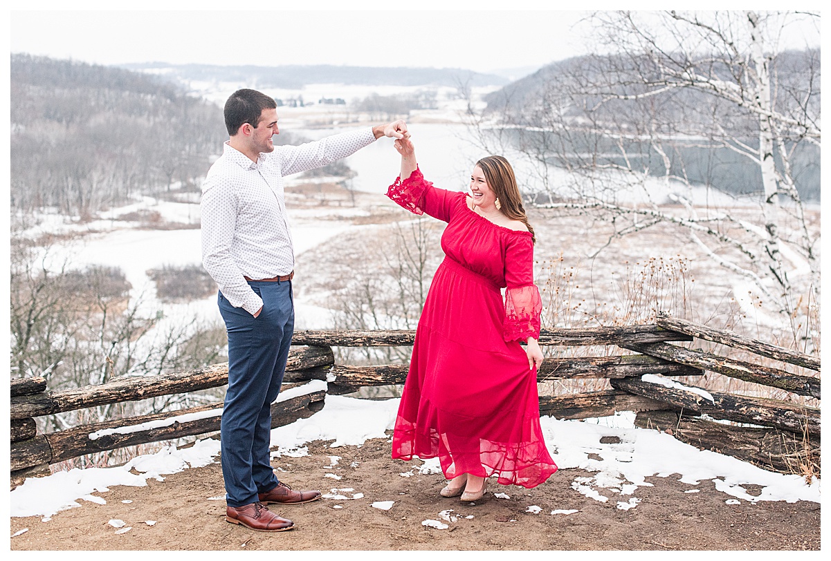 a couple dancing at the top of indian lake county park for their engagement photos