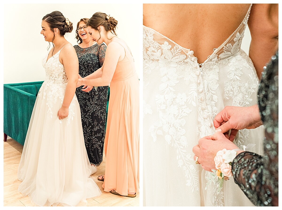 mother of bride buttoning the wedding dress at the eloise wedding barn in mt horeb