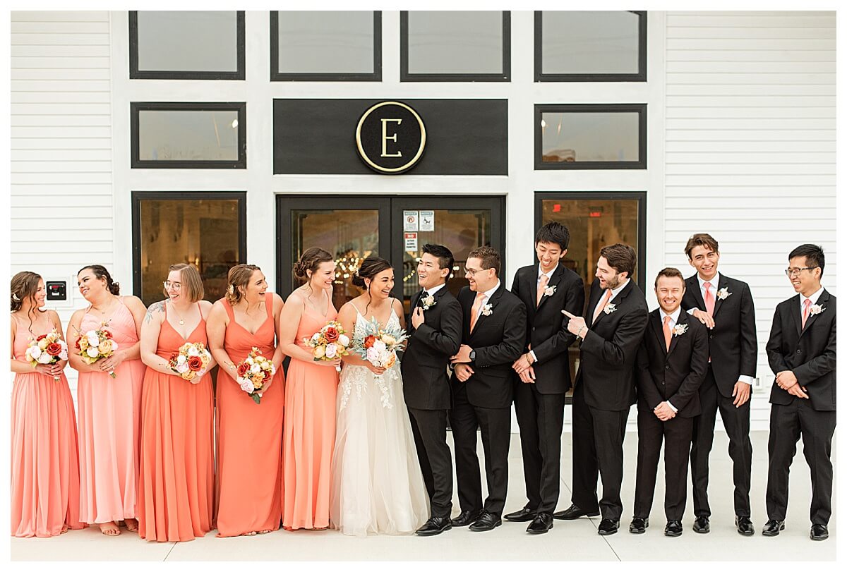 wedding party posing for photos outside of the eloise wedding venue by wisconsin wedding photographer morgan madeleine photography