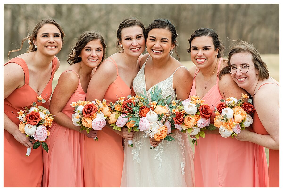 bridesmaids smiling for madison wedding photographer outside the eloise wedding venue in mount horeb wi