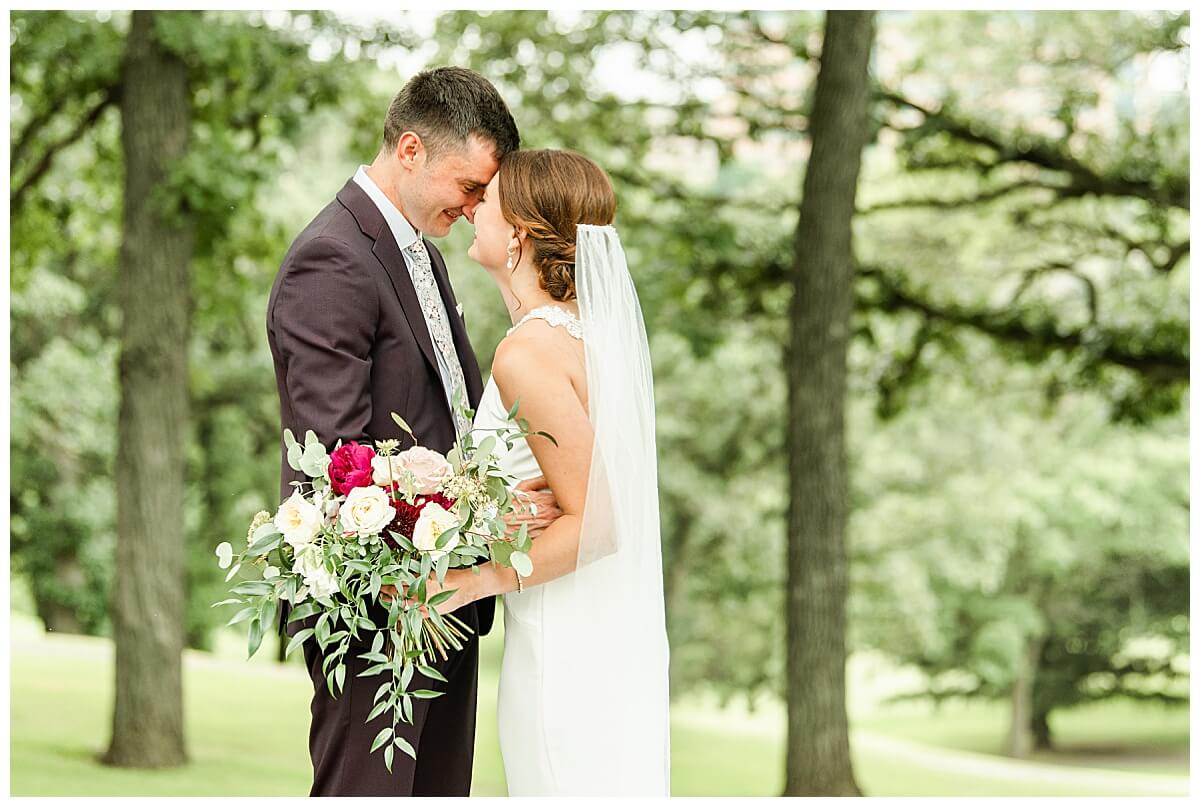 a bride and groom posing for wedding photography at blackhawk country club in madison wisconsin