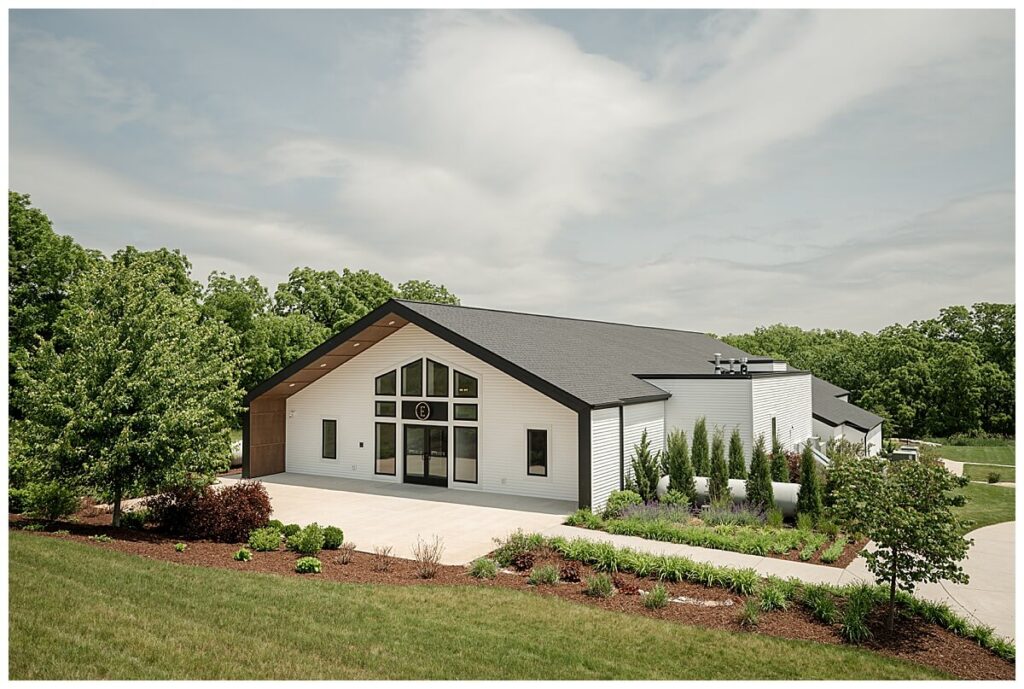 Modern white barn exterior of The Eloise Mt Horeb surrounded by fields