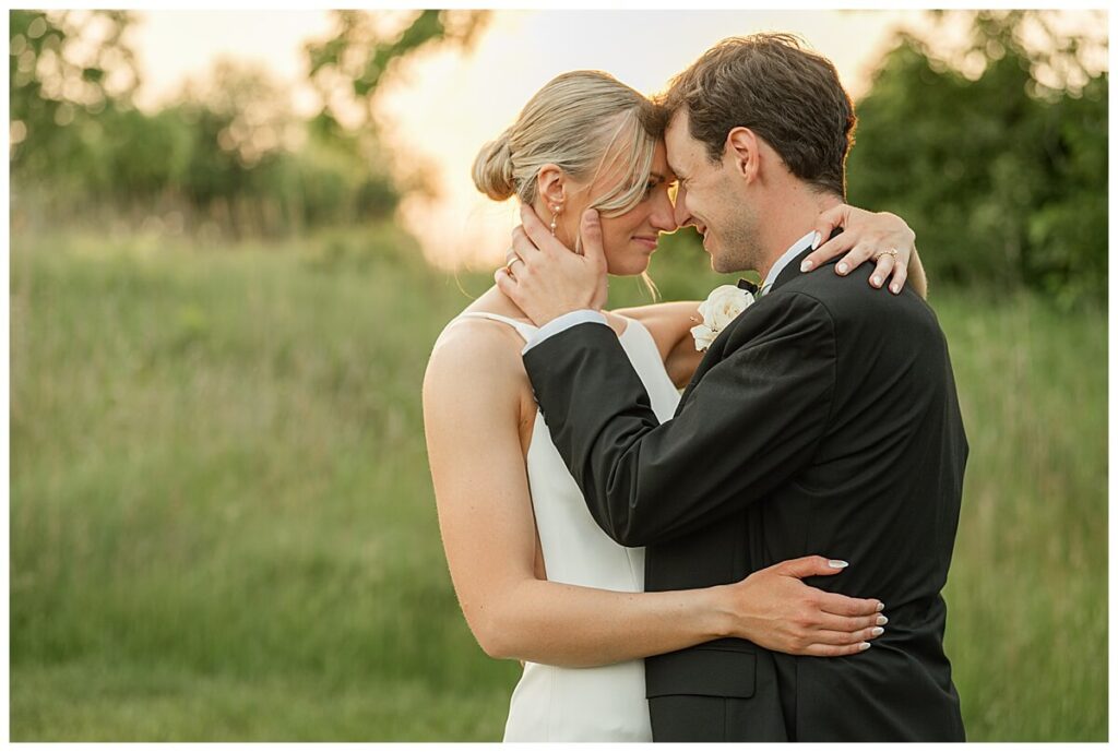 Bride and groom golden hour photos in fields outside The Eloise Wedding Venue