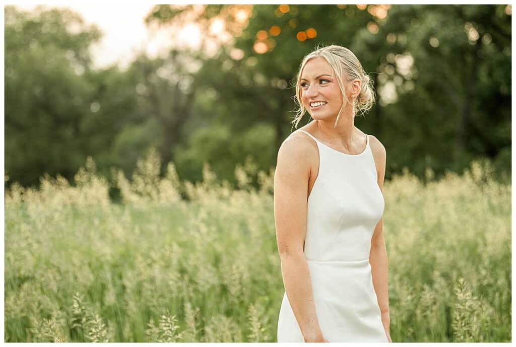 Bridal sunset portraits in fields outside The Eloise Wedding Venue